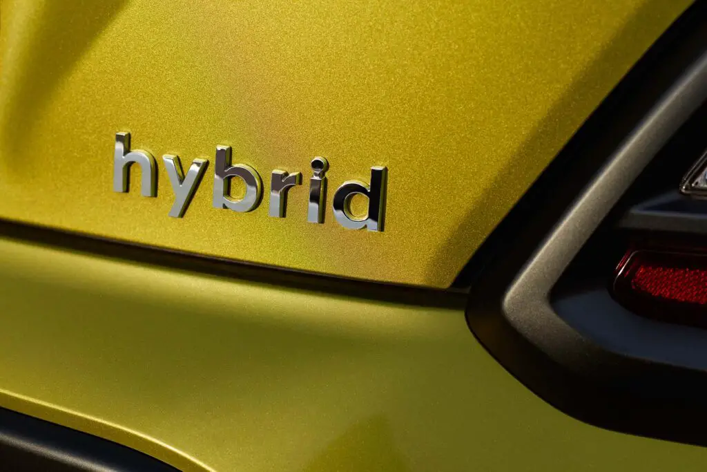 Chromed hybrid car logo on background