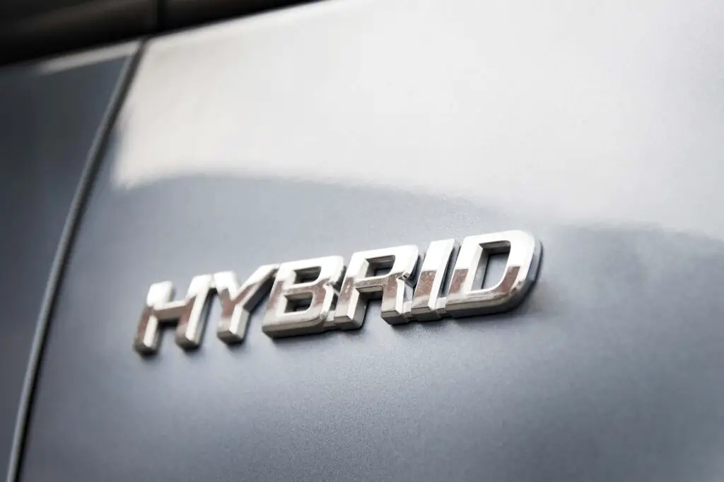 Hybrid inscription on the body of a modern car