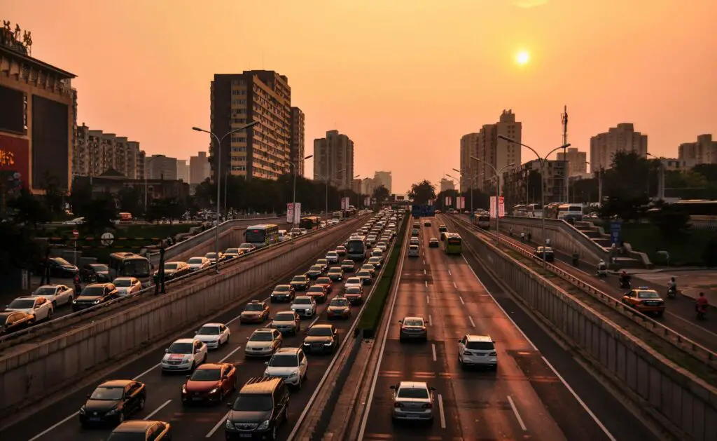 Vehicles on the freeway at sunset