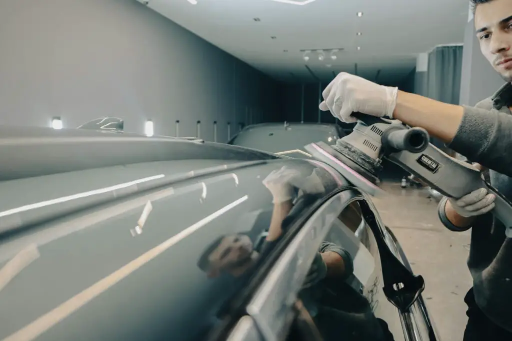 Man polishing a car