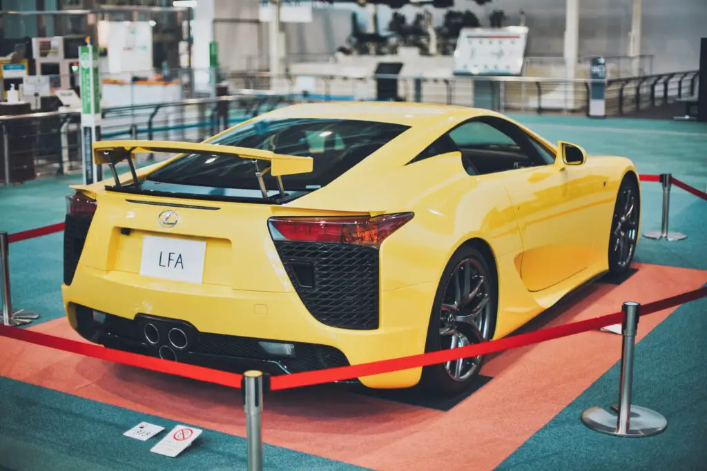 A yellow Lexus LFA on display