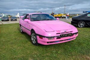 A pink Ford Probe on display