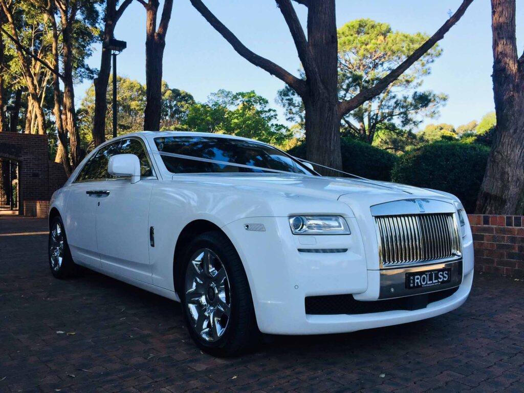 A white Rolls Royce parked